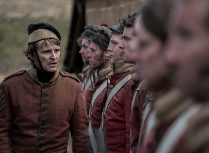 Damon Herriman as “Ruse”