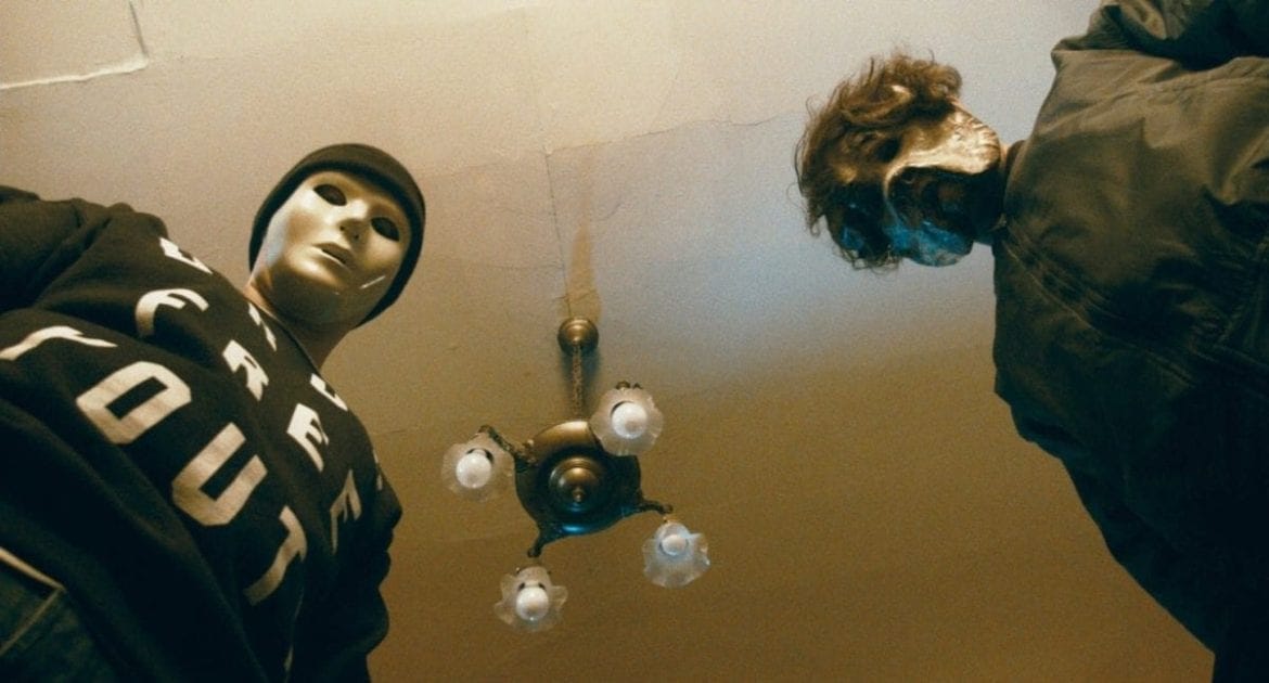 James (played by Julio Alexander) and Sean (played by Sean Jones) stare menacingly down at the camera in a tense scene from Straight Edge Kegger.