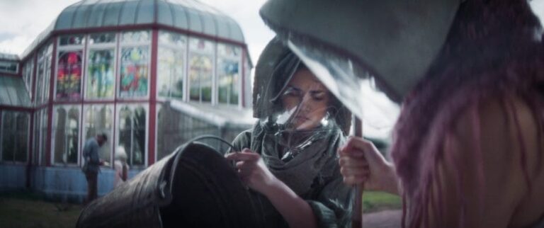 GLASSHOUSE Evie wears a gas mask against The Shred