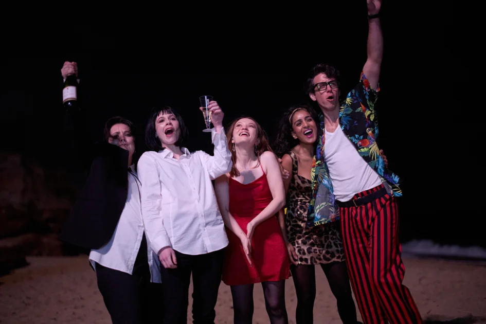 Group shot of One More Shot cast at NYE party.