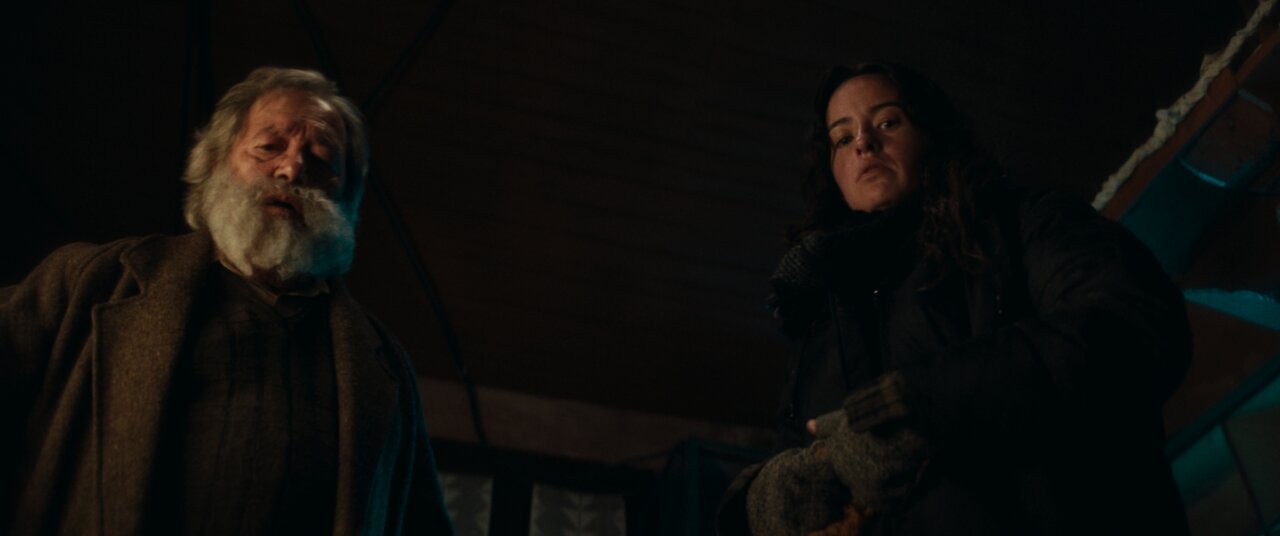 Dimly lit interior of Ernesto and Helena's home in Once Upon a Time in the Apocalypse, showing production design by Luis Sequeira