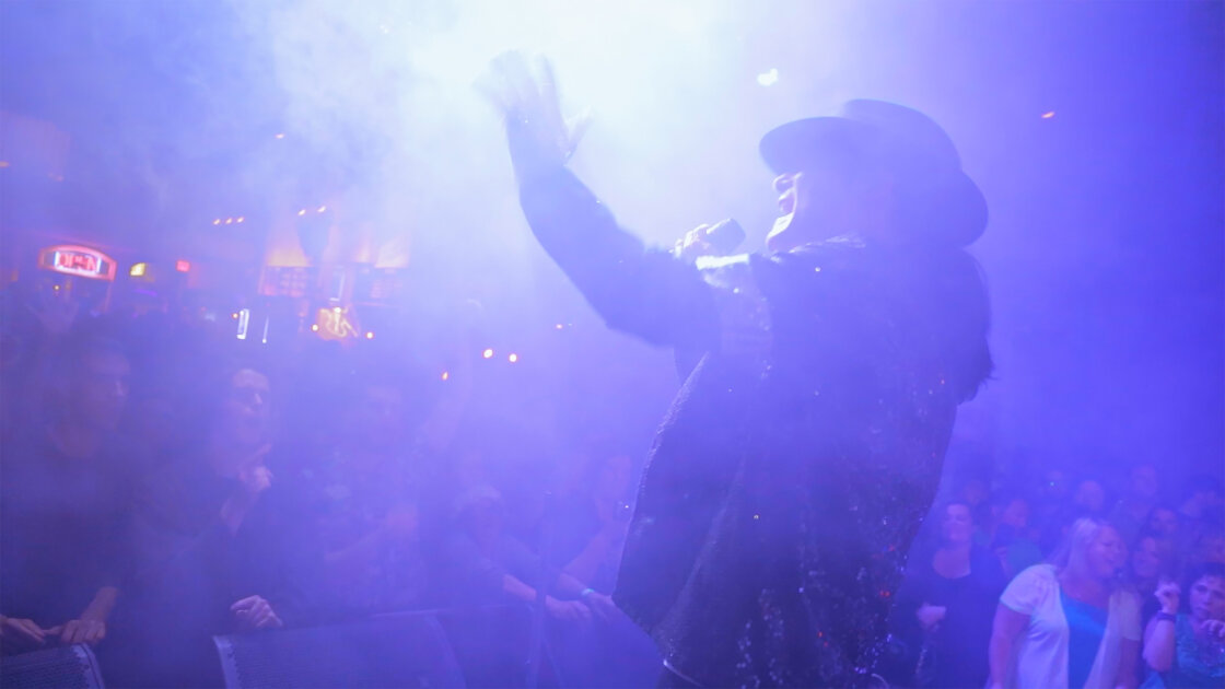 Corey Feldman performing on stage in documentary Corey Feldman VS the World directed by Marcie Hume