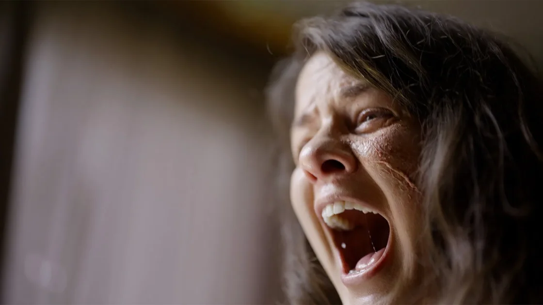 A scene from Wormtown (2025) showing the practical effects and grimy atmosphere of the parasite outbreak. Image courtesy of Good Deed Entertainment.