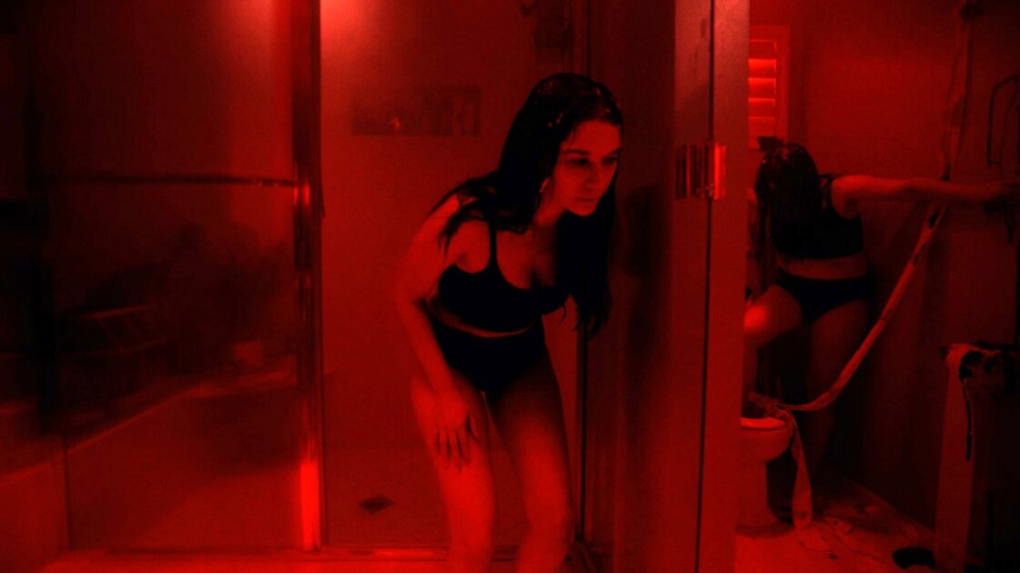 Penny discovers the expelled fat is alive in the shower scene from Thinestra (2026), directed by an unnamed Breaking Glass screener. Image courtesy of Breaking Glass Pictures